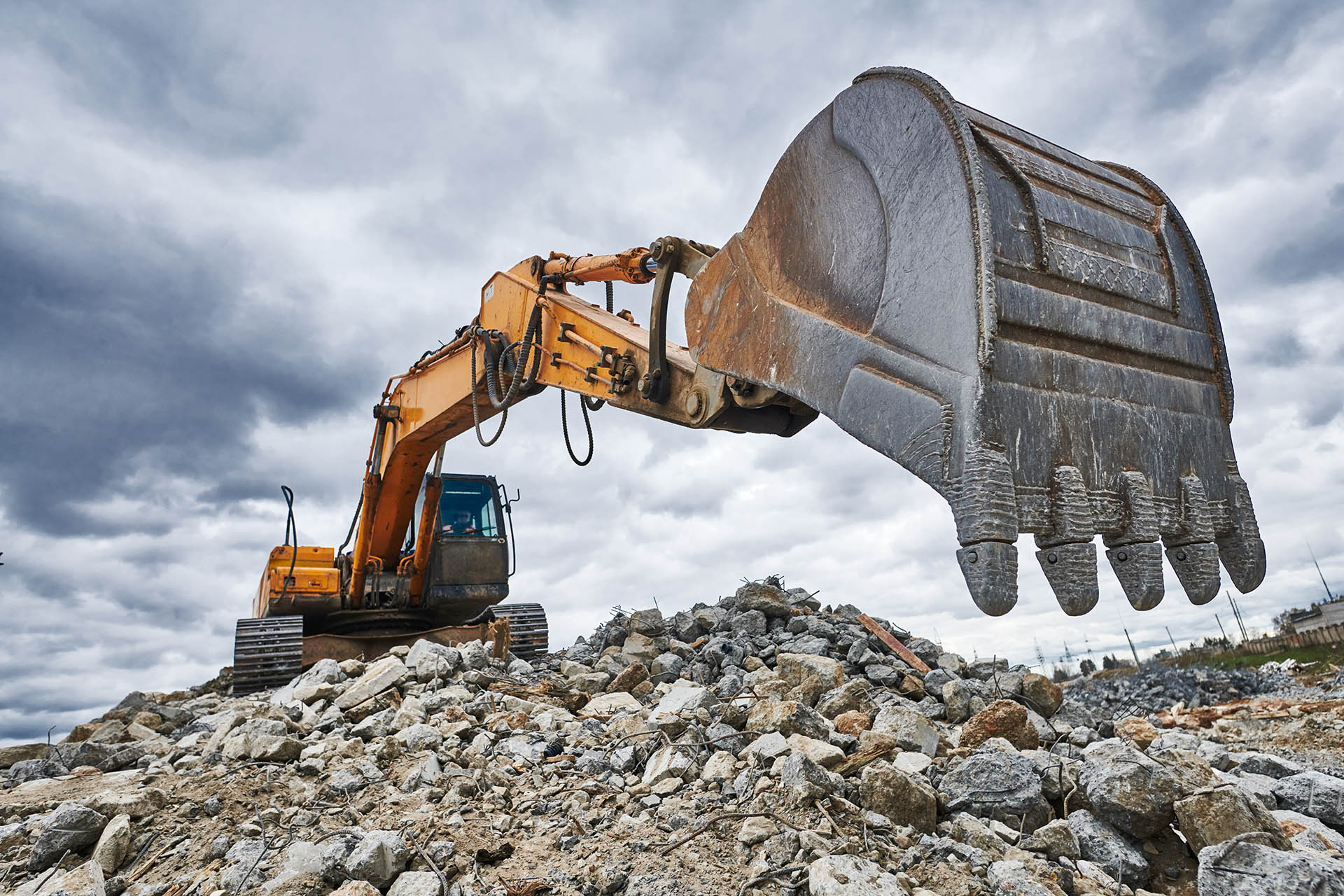 excavator loader machine at demolition or destroying works outdoors on construction site